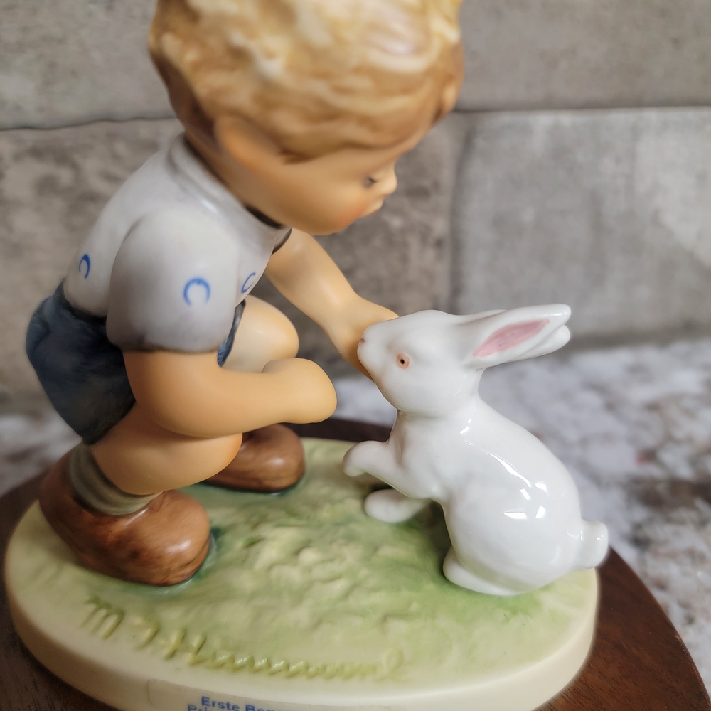 Hummel Figurine with Boy and White Rabbit Sits On Wood Base